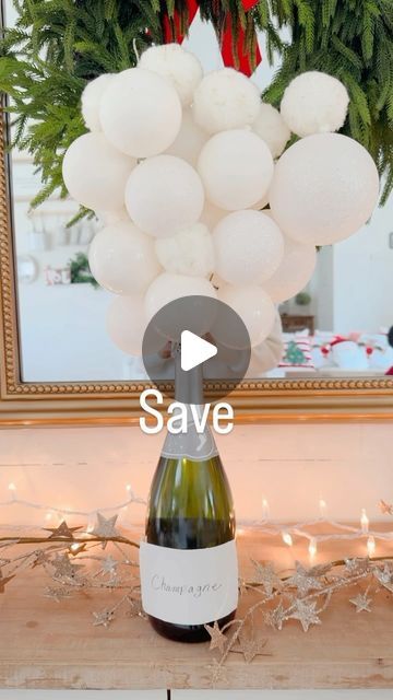 Cynthia Villegas | Affordable Home Decor & DIYS on Instagram: "Let’s Get Bubbly. New years Centerpiece
.
All you need is :
A champagne bottle – I used a jumbo one that we got for New Years 
Needle nose pliers, to cut the hanger
A wire hanger
Christmas Ball ornaments.  I used white .
.
Cut the hanger so that one edge is straight and the other has the top/curved edge.  Then just thread the ornaments of various sizes, starting with smaller ones if you have them, and building all the way up. 

#newyears #newyears #newyearsparty #newyearscelebration #newyearseveparty #newyearscelebration #centerpieces #champagne" Champagne Centerpiece Ideas, Champagne Centerpieces, Champagne Centerpiece, New Years Eve Decor, Hanger Christmas, Needle Nose Pliers, Christmas Ball Ornaments, Champagne Bubbles, New Year's Eve Celebrations