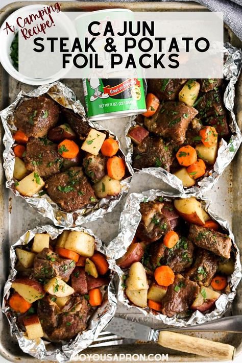 2 reviews · 30 minutes · Serves 4 · Cajun Steak and Potato Foil Packs - an easy camping meal and recipe! Steak, potatoes and carrots tossed in cajun seasoning then cooked over the campfire, in the oven, or on the grill! Yummy summer… Steak Potatoes And Carrots, Steak Foil Packets, Oven Steak, Cajun Steak, Joyous Apron, Foil Packet Potatoes, Foil Pack Dinners, Foil Packet Dinners, Steak Potatoes