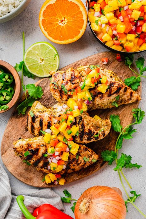 Grilled Mojo Chicken With Pineapple Salsa | Table for Two Chicken With Pineapple Salsa, Chicken Table, Mojo Chicken, Chicken With Pineapple, Cuban Chicken, Cucumber Salsa, Peach Salsa, Table For Two, Pineapple Salsa