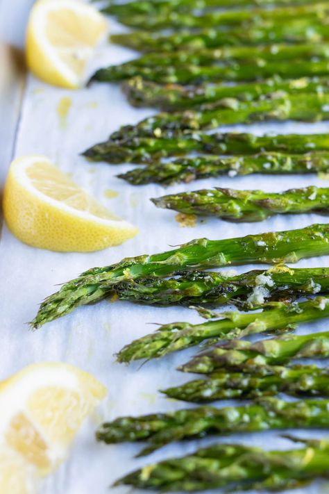 Make the perfect crisp and tender Roasted Asparagus every time with this easy recipe! Once the woody ends are trimmed away, the spears are coated in garlic and quickly baked in the oven to avoid getting soggy. Finish off this healthy side dish with a burst of fresh lemon zest to take it over the top! How To Make Asparagus In The Oven, Steakhouse Asparagus, Roasted Asparagus Recipes, Asparagus In The Oven, Lemon Garlic Asparagus, How To Make Asparagus, Roasted Asparagus Recipe, Easy Asparagus Recipes, Cream Of Asparagus Soup