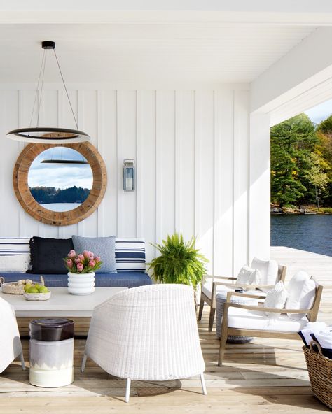 Straddling water and land, this Muskoka boathouse designed by @annehepfer epitomizes the best of lakeside living. #Houseandhomemag Photo by Virginia Macdonald | Design by Anne Hepfer Boathouse Interior, Muskoka Room, Boathouse Design, Muskoka Cottage, Boat Interior Design, Muskoka Chair, House Lake, Lakeside Living, Outdoor Living Rooms