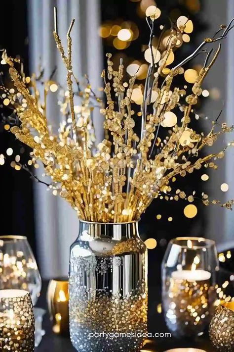 32 Timeless and Trendy New Year Centerpiece Ideas - Fun Party Games Ideas for Adults and Kids Nye Table Centerpiece, New Year’s Eve Flower Arrangement, New Years Eve Party Table Decorations, Dinner Party Centerpiece Ideas, Dollar Tree New Years Decor, New Year’s Eve Table Centerpiece, Nye Engagement Party, New Years Tablescapes, New Year’s Eve Photo Shoot Ideas