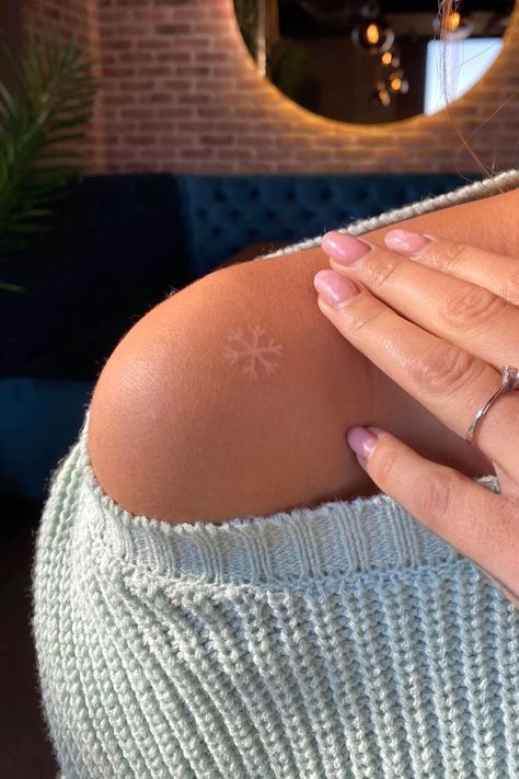 White Tattoo Snowflake, Snowflake Tattoo White, White Ink Snowflake Tattoo, Tattoo Ideas Snowflake, Snowflakes Tattoo Design, Frozen Inspired Tattoo, Subtle Christmas Tattoo, Sun And Snowflake Tattoo, Tiny Snowflake Tattoo