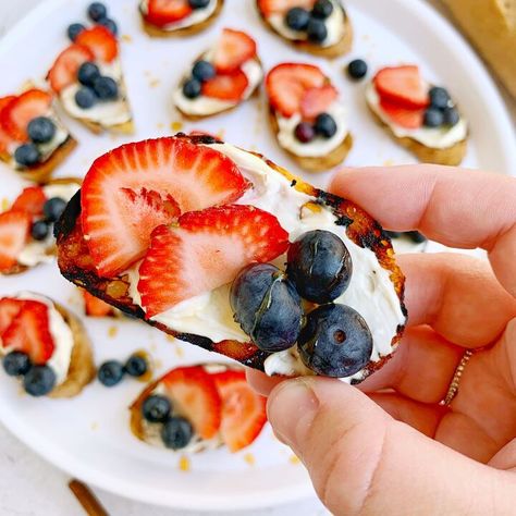 Today, we’re making Berry Crostini with Whipped Feta! These berry bites are all the best parts of sweet, savory, smokey, and spicy. We’re going to grill up some baguette slices, schmear them with a creamy whipped feta spread, and top them with fresh berries and spicy honey. Doesn’t that sound amazing??? Whipped Feta Crostini, Feta Crostini, Feta Spread, Berry Bites, Baguette Slices, Crostini Appetizers, Whipped Feta, Strawberry Slice, Sliced Baguette