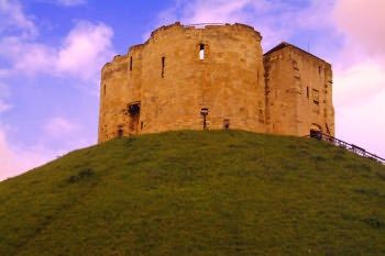 Clifford Tower is the only part of York Castle remaining. It has a bloody history, and was mostly used as a dungeon. York Castle, Falling Down, Monument Valley, Wales, Castle, Tower, England, Natural Landmarks, History