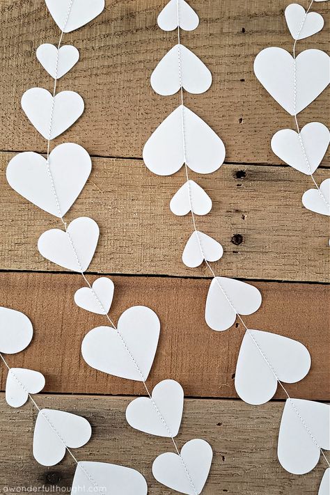 Hearts sewn together to make a heart garland How To Sew Paper Garland, Heart Paper Garland Diy, How To Make Paper Garland, Diy Heart Garland, Edible Paper Flowers, Diy Paper Garland, Diy Garland Paper, Valentine 2024, Diy Garlands