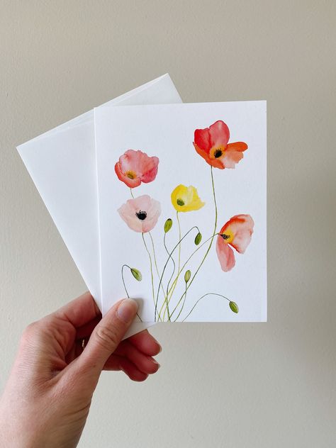 "This listing is for a single watercolor poppy greeting card. This is a blank folded flower notecard. Brightly painted watercolor poppies stand out on this floral greeting card. Each card comes with its own coordinating envelope. Fantastic to have on hand anytime you need a card. The inside of this card is blank. Folded size is A6, or 4.25\"x5.5\". The front of this card began as one of my original watercolor paintings and is reproduced beautifully on a premium 100% recycled matte paper." Things To Paint On Cards, Easy Watercolour Card, Fall Cards Handmade Watercolor, Watercolour Gift Cards, Floral Card Ideas, Notecard Drawings, Watercolour Thank You Cards, Water Colour Cards, Card Painting Ideas