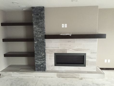 Offset fireplace and shelving can really help to bring the room together. Fireplace Tv Wall With Shelves On One Side, Offset Fireplace, Offset Fireplace Living Rooms, Asymmetrical Fireplaces, Off Center Fireplace, Fireplace Tv Wall, Rustic Mantel, Linear Fireplace, Shiplap Fireplace