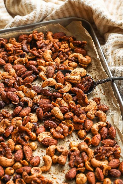 These perfectly seasoned, spicy nuts need just 5 minutes of prep, and are a good Whole30 compliant snack. They are much healthier than any store-bought alternative. The nut mix includes cashews, almonds, walnuts and hazelnuts, plus we share instructions for roasting the nuts just right. A easy gluten free and low carb homemade snack. @realsimplegood | The Real Simple Good Life Easy Homemade Snacks, Hazelnut Recipes, Spicy Nuts, Whole 30 Snacks, Nut Recipes, Roasted Nuts, Candied Nuts, Homemade Snacks, Latest Recipe