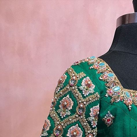 BlouseHousebyMahithaPrasad on Instagram: "Get ready for your queen-like regal look with Heavy Doses of Handcraft in this magnificent, made-to-order Dark Green Raw Silk Blouse from Blouse House by Mahitha Prasad. This royal piece dazzles with jewelled Buttas scattered all across its body, enhanced by distinctive sleeve embroidery. The intricate Jewelled Embroidery on the Neckline and Sleeve ends is done using a triad of Colorful Beads, Pretty Pearls and Sequins. Completing the look with the Bac Pearl Work Blouses, Green Embroidery Blouse, Raw Silk Blouse, House Of Blouse, Blouse Works, Mirror Work Blouse Design, Bridal Blouses, Mirror Work Blouse, Zardozi Embroidery