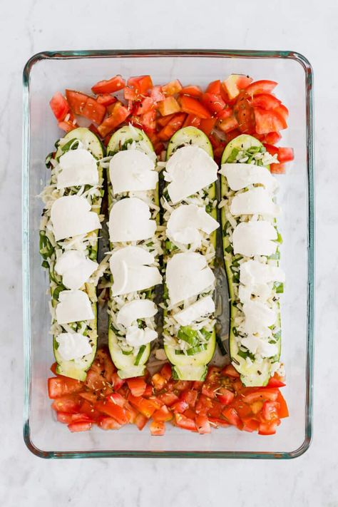 Healthy and delicious vegetarian stuffed zucchini boats with rice, tomatoes, and melted cheese on top! A light dinner recipe for two! #stuffed #zucchini #boats #vegetarian #recipes #rice Stuffed Zucchini Boats Vegetarian, Vegetarian Recipes Rice, Zucchini Boats Vegetarian, Vegetarian Stuffed Zucchini, Dinner Recipe For Two, Vegetarian Zucchini Boats, Vegetarian Stuffing, Best Zucchini Recipes, Vegan Ground Beef