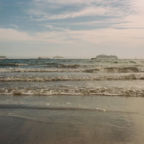 Step back in time with this vintage-inspired film photograph capturing the timeless beauty of Long Beach, California. Shot on film, this nostalgic image showcases the tranquil rhythm of the waves caressing the sandy shores, while boats gracefully adorn the distant horizon. With its dreamy hues and retro charm, this photograph evokes a sense of nostalgia and serenity, perfect for adding a touch of coastal elegance to any space. *This is a digital download* *Frame is not included* Keywords: Long Beach California, vintage photograph, film photography, beach waves, boats on water, coastal decor, retro beach print, coastal photography, vintage California art, beach wall art. Serenity Aesthetic, Freetime Activities, Beach Film, Coastal Photography, Shot On Film, Beach Boat, Coastal Elegance, Nostalgic Images, Retro Beach