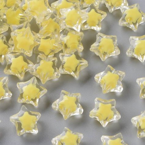 These sweet star beads are great for jewelry and crafts! They feature a lovely yellow and clear color with a "bead in a bead" design. You will receive 20 pieces. Color: Yellow/clear -Size: 14mm  Thickness: 9mm Hole: 2mm Blue And Yellow Aesthetic, Yellow Core, Aesthetic Stars, Star Core, Sky Jewelry, Marble Falls, Star Beads, Yellow Star, Yellow Design