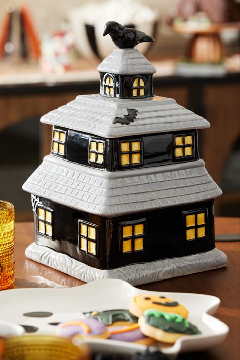 A to-die-for addition to your kitchen counter, our airtight Haunted House Figural Ceramic Cookie Jar entombs baked treats in the spooky confines of a gothic haunted house. Both a functional cookie canister and whimsical Halloween decor, it's perfect for October entertaining. #WorldMarket #CookieJar #Halloween #HalloweenDecor #HalloweenKitchenDecor Gothic Haunted House, Blue Banisters, Halloween Kitchen Decor, Haunted House Halloween, Halloween Entertaining, Ceramic Cookie Jar, Baked Treats, Whimsical Halloween, Halloween Haunted Houses