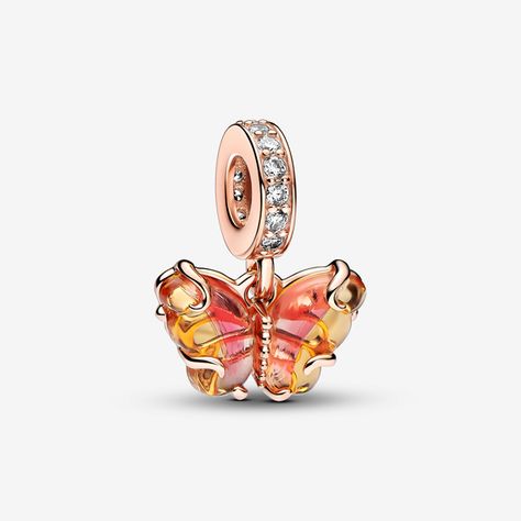 Transform into your best self with the Pink & Yellow Murano Glass Butterfly Dangle Charm. This 14k rose gold-plated charm features Murano glass wings in an orange-and-pink gradient with a cut-out pattern on the back that shows through the glass, and 14k rose gold swirls on the front. Microbeads on the butterfly's body and pavé on the bail add a touch of delicate sparkle. Add this bright butterfly to your look as a powerful symbol of transformation and new beginnings. - Pandora Pink & Yellow Mura Pandora Pink, Pandora Rose, Charms Pandora, Disney Classics, Bracelet Pandora, Glass Butterfly, Bracelet Charms, Pandora Bracelet Charms, Butterfly Charm