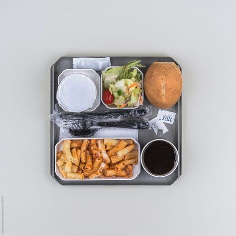 Although many American airlines no longer offer a true meal service, if you fly internationally, this should be a familiar sight. Bland pasta with minimal cheese, rock-hard cold bread roll, wilted lettuce and some kind of random mushy fruit cup. ENJOY! Airplane Tray Table, Airline Meal, Flight Food, Airline Catering, Airport Food, In-flight Meal, Airplane Food, Airline Food, Cafeteria Food