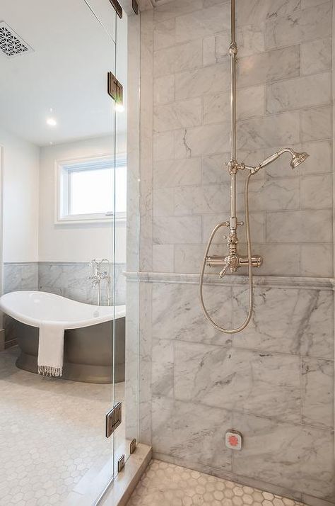 Walk-in shower featuring mixed gray marble shower tiles with marble chair rail tiles fitted with a vintage exposed plumbing shower kit enclosed by glass doors. Marble Chair, Exposed Plumbing, Marble Shower Tile, Bathroom Chair, Master Bath Renovation, Shower Plumbing, Shower Tiles, New House Bathroom, Marble Showers