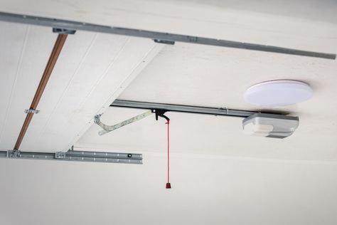 Installing a Garage Door Opener Is an Easy DIY Project—Here's How to Do It Wooden Garage Door Repair, Garage Door Panel Replacement, Garage Door Spring Replacement, Garage Door Opener Installation, Liftmaster Garage Door Opener, Electric Garage Doors, Garage Door Panels, Commercial Garage Doors, Garage Door Openers