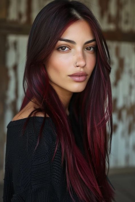 Young woman with long burgundy hair and subtle makeup looking at the camera. Dark Red Hair On Olive Skin, Wine Red Balayage Hair, Red Hair For Pale Skin, Red Hair With Brown Roots, Cool Red Hair Color, Light Red Highlights, Cherry Red Brown Hair, Red Hair Makeup Ideas, Red Hair Inspo Color