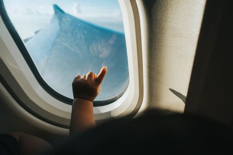 A parents' guide for flying with a baby or young kids, with tips on what to pack, getting your gear through security, and more. Airplane Window View, Cebu Pacific, Flying With A Baby, Airplane Window, Airline Flights, Delta Airlines, Clear Blue Sky, Conde Nast Traveler, Conde Nast