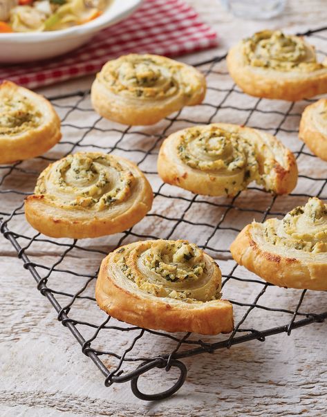 Puff Pastry Pinwheels with Boursin Cheese | Puff pastry is a French delicacy made by rolling cold butter into multiple layers of dough. When baked, the butter melts and creates steam, causing the dough to puff. While all that buttery, crispy goodness sounds great on its own, if you spread Boursin cheese all over it before baking and roll it up into pinwheels, it's even better. #cuisineathome #sidedishrecipes #sides #dinnersidedish #sidedishes #sidedishideas #food #recipe #bread Boursin Cream Cheese Puff Pastry Appetizer, Boursin Cheese Appetizers, Boursin Appetizers, Picnic Meals, Boursin Cheese Recipes, Pastry Pinwheels, Boursin Recipes, Puff Pastry Pinwheels, Puffed Pastry