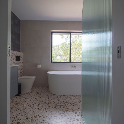 Denim + terrazzo - is that a classic cool pairing for a mid-century modern bathroom? We think so. A wall was removed, picture window installed, and entry door relocated. This gave us more room for a full bath. Terrazzo on the floor and half wall with denim tiles on top. Nib wall. Walk-in shower. Ribbed shower screen. 70's cool with a modern vibe. Photography @claudineburgess Interior design + custom joinery @plushdesigninteriors Design documentation @plushdesignrenovations Demolition and bui... Design Documentation, Mid Century Modern Bathroom, Picture Window, Picture Windows, Shower Screen, Window Installation, Entry Door, Modern Vibe, Full Bath