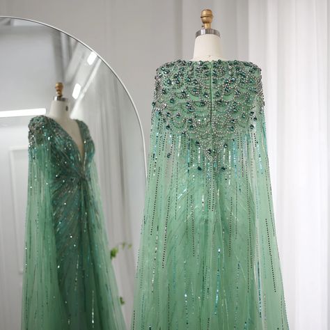 dress search:SS399 https://www.dreamyvow.com/collections/all-evening-dresses/products/luxury-dubai-sage-green-evening-dresses-with-cape-fuchsia-crystal-gold-elegant-women-wedding-formal-party-gown-399 Glitter Green Dress, Green Evening Dresses, Elegant Cape, Yellow Evening Dresses, Cape Sleeve Dress, Grey Evening Dresses, Sequin Cape, Champagne Evening Dress, Gold Evening Dresses