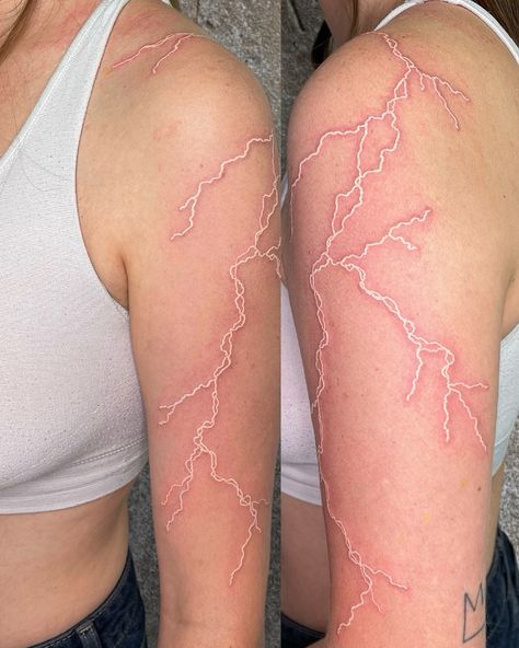 White Ink Cloud Tattoo, White Ink Lightning Tattoo Hand, Lightning Shoulder Tattoos For Women, White Tattoo Lightning, White Lighting Tattoo, Freedom Tattoo For Women Inspiration, Lightning Arm Tattoo, White Ink Lightning Tattoo, Lightning Tattoo Women