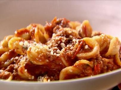 Weeknight Bolognese Recipe | Ina Garten | Food Network Pasta Bolognese Recipe, Pasta With Meat, Weeknight Bolognese, Pasta Bolognese, Ina Garten Recipes, Ground Sirloin, Bolognese Recipe, Drying Pasta, Spare Ribs