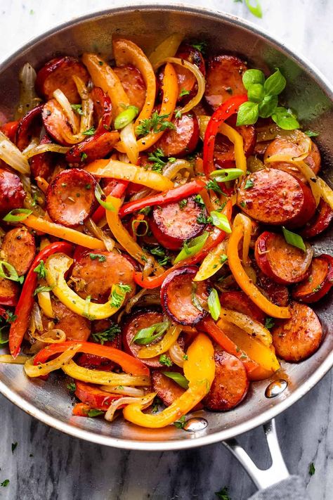 Featuring savory smoked sausage slices, colorful veggies, and a rich medley of herbs and spices, this Smoked Sausage and Peppers Skillet is the ultimate quick dinner everyone will love! Chicken Sausage And Peppers Skillet, Italian Sausage With Peppers And Onions Easy Recipes, Onions Peppers And Sausage, Sauteed Sausage And Peppers Onions, Peppers Onions And Sausage, Sausage And Onions Recipes, Peppers And Onions Sausage, Smoked Sausage Stir Fry Recipe, Sausage Stir Fry Recipes