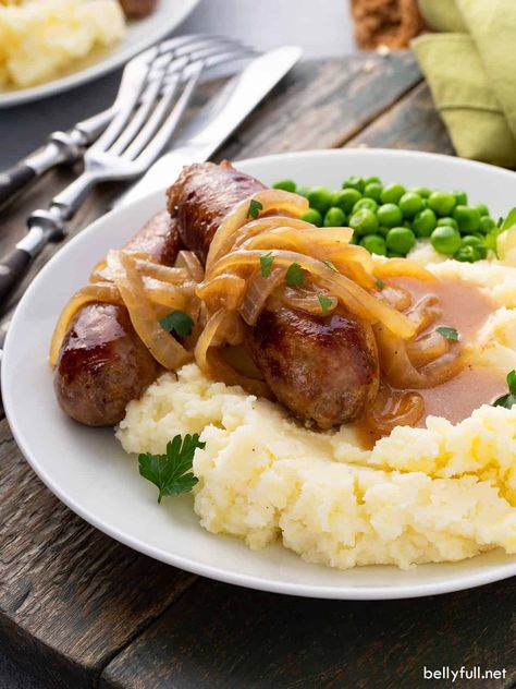 This recipe for Irish Bangers and Mash is coated in a wonderful rich onion gravy and served over the best mashed potatoes. It’s so easy to make and is a perfect weeknight meal for the entire family. Great on Saint Patrick’s Day or all year round! Work Salads, Irish Bangers, Bangers And Mash Recipe, Irish Sausage, Irish Recipes Authentic, Sausage And Mash, Slow Cooker Corned Beef, Easy Mashed Potatoes, Best Mashed Potatoes