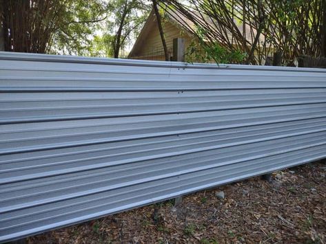 horizontal metal panel fence Corrugated Tin Fence, Tin Fence Ideas Diy, Metal Sheet Fence Ideas, Diy Metal Fence Ideas, Steel Panel Fence, Corrugated Metal Fence Ideas, Corrugated Metal Deck Railing, Corrugated Metal Deck Skirting, Metal Panel Fence Ideas