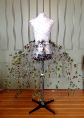 diy chicken wire dress form.........tutorial | After protecting my mannequin, I used chicken wire to create a stiff ... Evergreen Dress, Christmas Mannequin, Wire Dress Form, Dress Form Christmas Tree, Wire Dress, Mannequin Christmas Tree, Christmas Tree Dress, Mannequin Art, Tree Dress