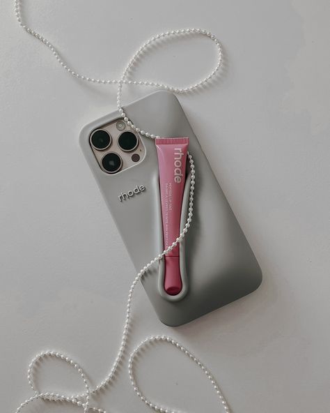 the main character of my feed @rhode lip case + lip tint ribbon 🎀 #rhode #makeuplover #liptint #lippies #minimalmakeup #thatgirlaesthetic #pinterestaesthetic #flatlaystyle #moodboardaesthetic Rhode Lip, Fsa Eligible Items, Rose Taupe, Minimal Makeup, Flatlay Styling, Fashion Toys, Hailey Bieber, Main Character, Lip Tint