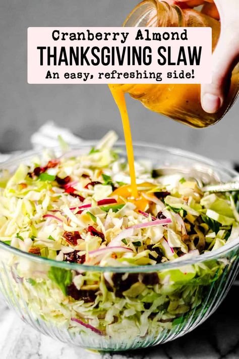 Looking for a unique salad to add to your Thanksgiving menu? Try this Cranberry Almond Slaw with Apple Cider Vinaigrette! It is easy to make, light, and refreshing. This Thanksgiving slaw is the perfect side dish to complement the typically rich and heavy sides! Make it ahead but toss the dressing right before serving for the best results! Cranberry Almond Thanksgiving Slaw, Semi Homemade Thanksgiving Recipes, Bougie Thanksgiving Recipes, Vegetable Dishes For Thanksgiving, Thanksgiving Coleslaw, Salads For Thanksgiving Dinner, Thanksgiving Slaw, Apple Cider Turkey Brine, Cider Turkey Brine