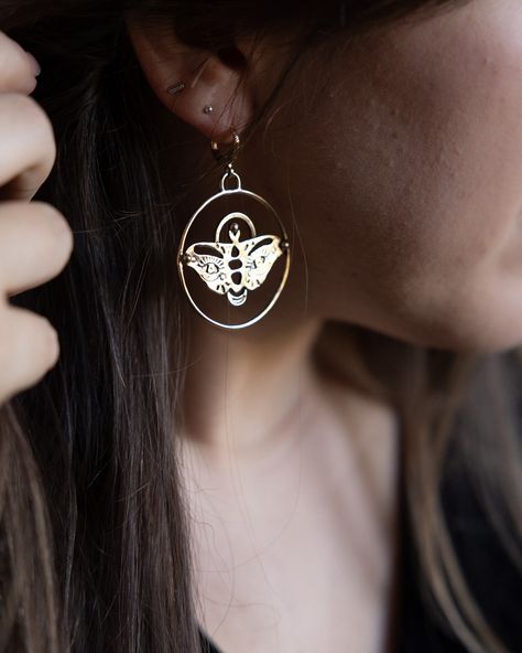 ✨ Evil Eye Moth Earrings….but make them GOLD!💫 Ya’ll know I’m a silver girl at heart, but as of late gold has captured me! >>> These babes are now available in both SILVER & GOLD! The gold moth is made from brass to keep it affordable, with gold-plated huggies for no irritation! Available now in my shop 🦋💫👏🏻 Moth Earrings, Evil Eye, Moth, Silver Gold, I Shop, Gold Plate, Plating, Brass, Silver