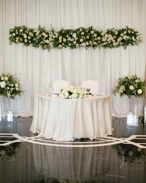 Sweetheart table dreams. The way this floral was hanging in mid-air over A|T's table was magical. What are your sweetheart or head table dreams? Let's talk today about your vision and let us guide you to bringing it all to life. #sweethearttabledreams #sweethearttable #ocalafl #ocalaweddingplanner #ocalawedding #goldenocalawedding Simple Sweetheart Table, Wedding Sweetheart Table, Sweetheart Table Decor, Heart Table, Magnolia Wedding, Sweetheart Table Wedding, Head Table, Bridal Suite, Sweetheart Table