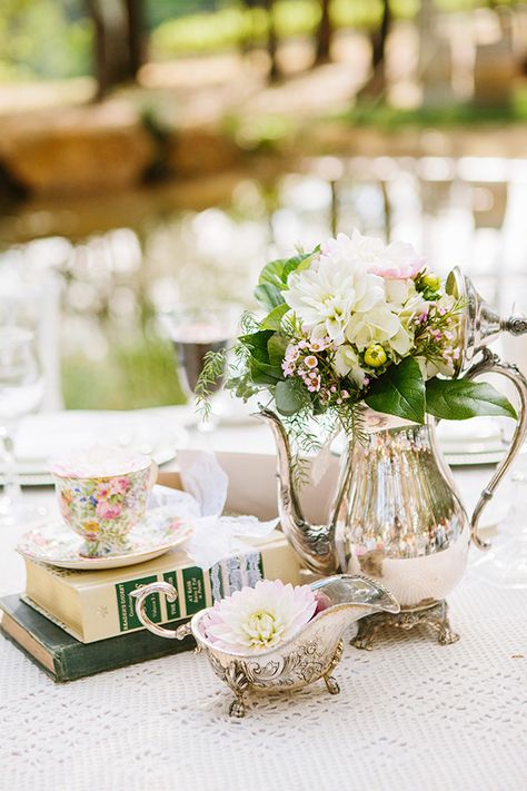 vintage teapot centerpiece ideas http://www.weddingchicks.com/2013/09/30/vintage-vineyard-wedding/ Vineyard Wedding Centerpieces, Teapot Centerpiece, Books And Flowers, Vintage Wedding Centerpieces, Literary Wedding, Wedding Notes, Vintage Teapot, Vintage Wedding Decorations, Flower Centerpieces Wedding