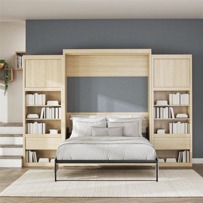 This platform murphy bed gives you a spot to sleep without sacrificing the style of your guest room or home office. It folds against the wall when you need extra floor space, and it blends seamlessly into the background as a bookcase or cabinet when not in use. The structure is crafted from engineered wood, and it comes in a sleek, solid finish for a modern touch. Two storage compartments, one on each side, include a cabinet, drawer, and multiple shelves to tuck away items and display decor. A b Side Cabinet Storage, Bedside Bookcase, Loft Style Apartments, Full Size Murphy Bed, Queen Murphy Bed, Bed Dimensions, Cabinet Bed, Room Additions, Beds And Headboards