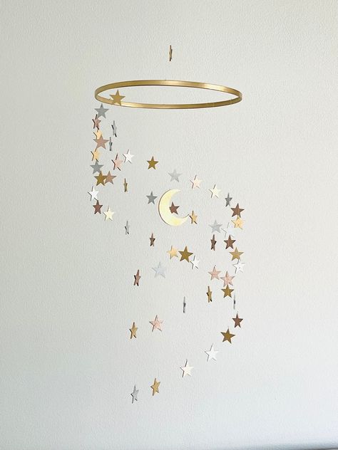 This is a beautiful wood stars and moon mobile. It will perfectly accompany a girl or a boy nursery. It is a beautiful piece of decor as well as something that will attract your baby's eye. With a slight breeze, every piece of this mobile will spin in a beautiful motion. This mobile is made of natural wooden stars and moon.. The mobile is 10,5 inch wide and 23 inch high. Please note: Mobile should only be used for decoration! It is not a toy! Mobiles should be securely hanged out of reach of chi Boho Celestial Nursery, Astral Nursery, Sun And Moon Themed Nursery, Sun Moon Nursery, Goodnight Moon Nursery, Moon Nursery Girl, Celestial Nursery Girl, Star Nursery Girl, Moon And Stars Nursery Girl