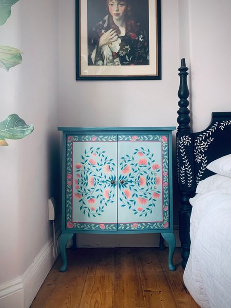 A true original. This carefully restored and hand-painted cabinet is one of a kind. The base colour is a soft, muted turquoise. The botanical floral decor is brush painted, petal by petal, in pink and ivory . Each drawer has a beautiful glass handle and is finished with a durable, high quality lacquer and furniture wax. COLLECTION IN EXETER ONLY.  LOCAL DELIVERY IS AVAILABLE WITHIN DEVON, CORNWALL AND SOMERSET FOR £20: LOCAL PICK UP IS FREE AND AVAILABLE IN EXETER, DEVON. SHIPPING COASTS FOR THE Colourful Wooden Furniture, Flower Painting Furniture, Painted Furniture Modern, Hand Painted Closet, Eclectic Painted Furniture, Hand Painted Shelf Ideas, Stencil Painted Furniture, Hand Painted Cabinet Ideas, Cool Painted Furniture