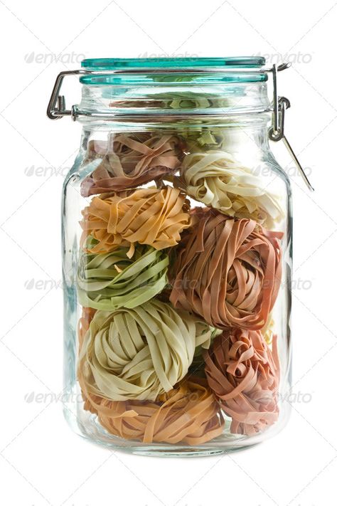 colorful pasta tagliatelle in glass jar by jirkaejc. colorful pasta tagliatelle in glass jar on white background #AD #tagliatelle, #glass, #colorful, #pasta Pasta Jars, Pasta Tagliatelle, Colorful Pasta, Jar Display, Fun Kitchen, Italian Pasta, Website Templates, Glass Jar, Cool Kitchens