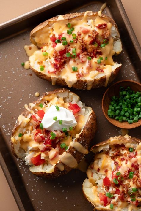 Cheesy Loaded Baked Potatoes with Chicken and Bacon #bakedpotato #chicken #bacon #cheese #tomato #dinner #dinnerrecipe | Peas and Crayons Baked Potatoes Loaded, Baked Potatoes With Chicken, Chicken Baked Potato, Baked Potato Chicken, Chicken Bacon Cheese, Tomato Dinner, Baked Potato With Cheese, Chicken Potato Bake, Potato Chicken