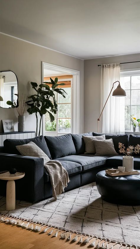 Dark Living Room Ideas! 25+ Inspirational Dark Living Rooms.. Living Room Dark Grey Couch, Dark Sectional, Living Room Inspiration Pink, Dark Sofa Living Room, Cottagecore Living Room Ideas, Pink Rug Living Room, Dark Grey Couch, Dark Flooring, Living Room Inspiration Cozy