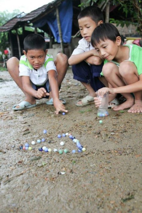 games from around the world -- marbles Games From Around The World, Playing Marbles, Childhood Photography, Childhood Memories Art, Harmony Day, International Games, Listen To Your Heart, World Vision, Art Village