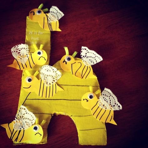 Letter H - h is for hive. Bees with stripes (good fine motor skills practise) and doily wings. For some reason my son decided they needed to have sad faces! Preschool Letter, Preschool Letters, Letter H, Bee Hive, Fine Motor Skills, Fine Motor, Motor Skills, My Son, Doilies