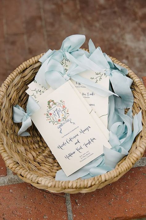 What to Include in Your Wedding Ceremony Program (with Examples) Preppy Wedding, Light Blue Ribbon, Wedding Crest, Wedding Ceremony Programs, Wedding Stationery Design, Wedding Monogram, Ceremony Programs, Beach Wedding Invitations, Wedding Ribbon