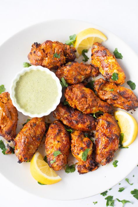 These smoky-flavoured Tandoori chicken wings, marinated in Indian spices and yogurt and grilled to perfection, will blow your mind away! The wings are succulent and juicy on the interior and crispy on the outside. Tandoori Chicken Wings, Easy Indian Appetizers, Marinated Chicken Wings, Lemon Pepper Wings, Indian Chicken Recipes, Indian Appetizers, Tandoori Masala, Indian Chicken, Coconut Chicken