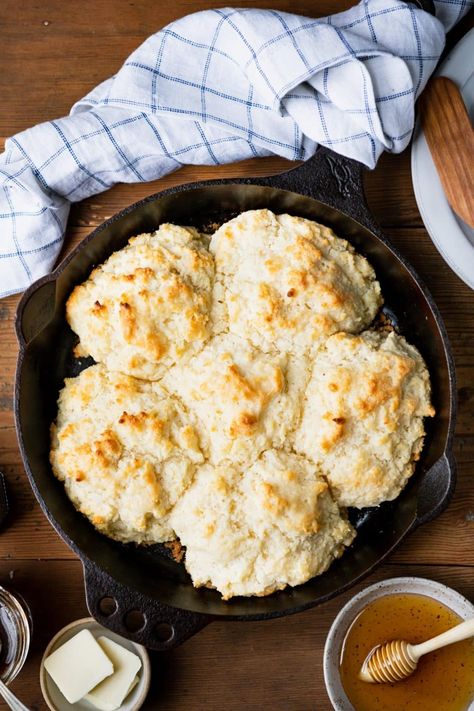 A staple in Appalachian cuisine and now popular throughout the South, cathead biscuits are an easier, larger, more rustic version of the traditional buttermilk biscuit. There's no need to roll or cut the dough -- just pinch off portions, drop them in a skillet, and pop them in the oven! Cathead Biscuits, Cat Head Biscuits, Mocha Protein Shake, Dutch Oven Beef, Easy Drop Biscuits, Buttermilk Biscuit, Spoon Bread, The Seasoned Mom, Cheddar Biscuits