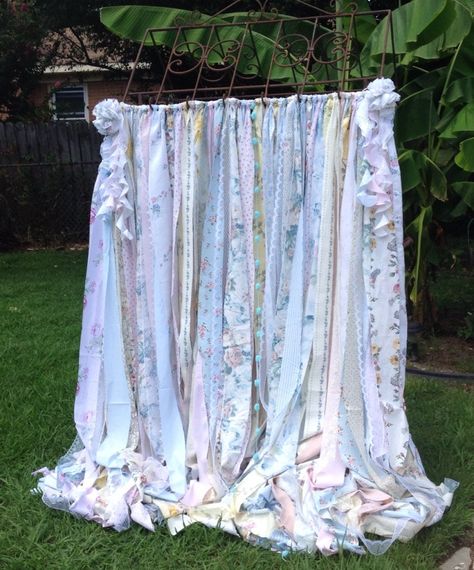 "Shabby Chic Curtains with vintage fabric ribbons  tattered and torn handmade assorted vintage  shabby chic prints, solids and lace  to make this adorable long garland curtain. Pink,yellow,mint,ivory,tan,baby blue     Pom Pom Bows are not included, they can be purchased here:  www.etsy.com/listing/219086620/pom-pom-balls-fabric-balls-pew-bows Adorable for babies nursery or a little girls room. Nursery, Bedroom, Living Room Curtains, CottageCore decor hand tied repurposed and recycled fabric stri Shabby Chic Prints, Garland Curtain, Rag Curtains, Shabby Chic Garland, Blush Curtains, Silk Wrap Bracelets, Burlap Garland, Rag Garland, Fabric Balls